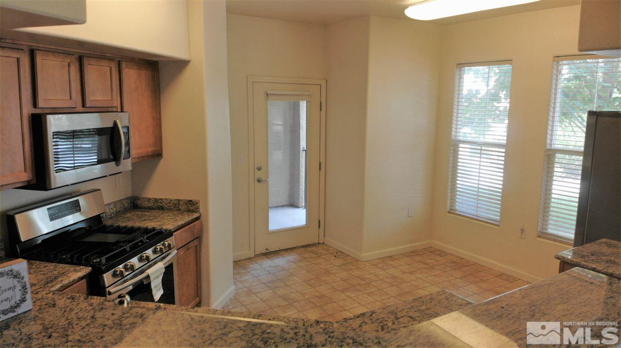 9050 Double R Boulevard, Unit 1612 Reno, NV 89521 - Photo 9 of 25 a kitchen that has a sink and a stove