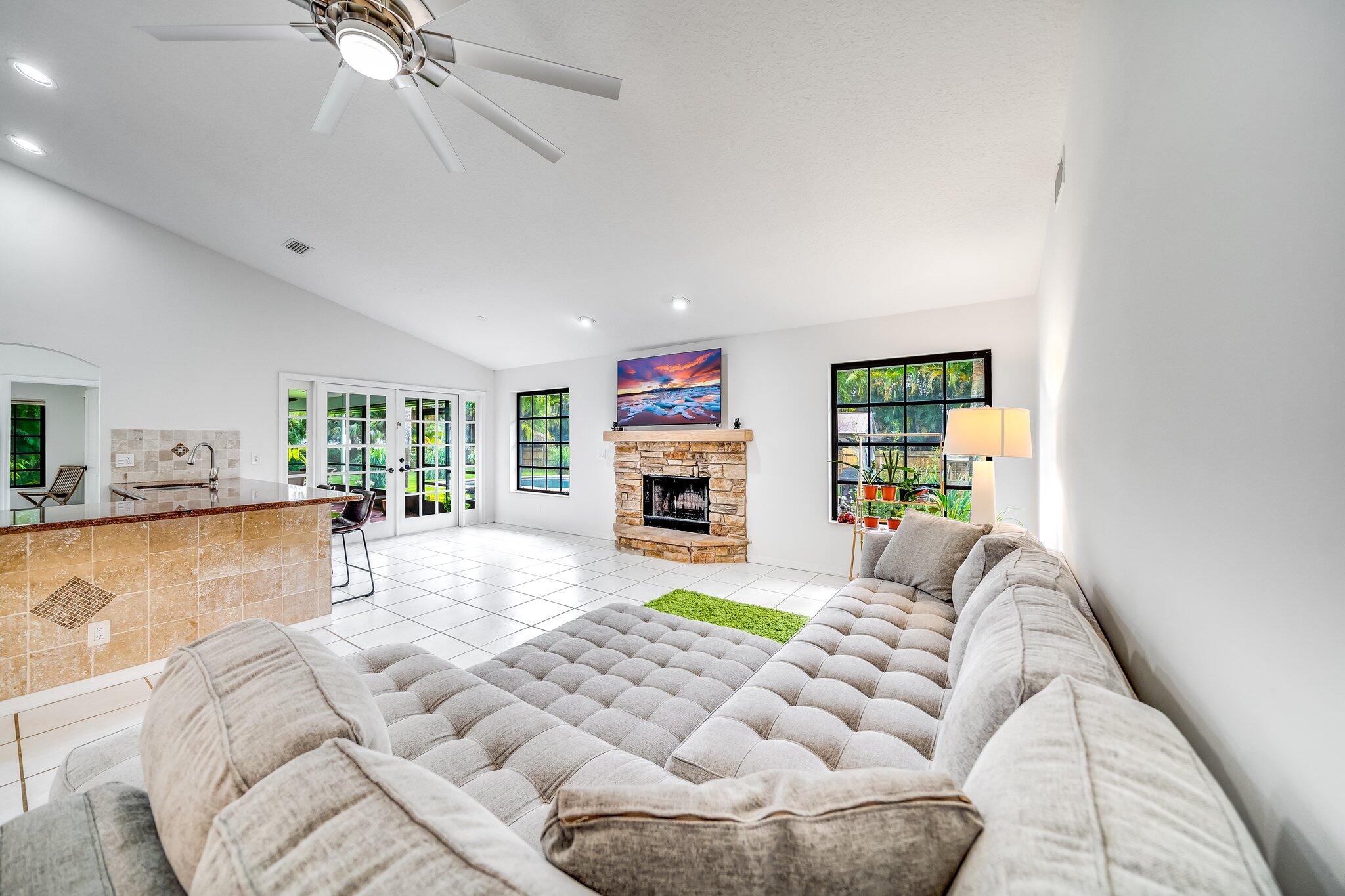 9268 Rodeo Drive Lake Worth, FL 33467 - Photo 13 of 66 a bed room with a bed and a couch