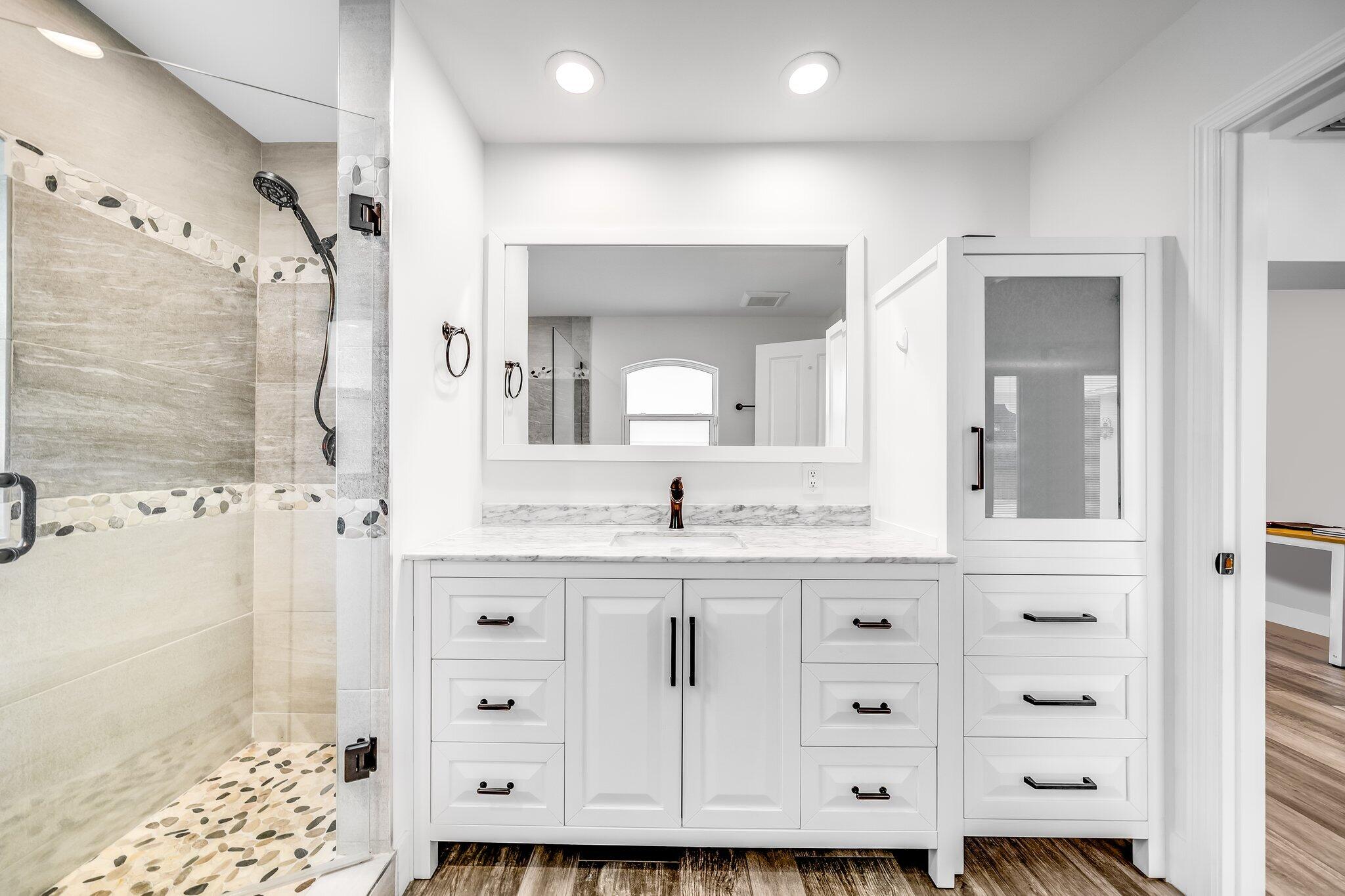9268 Rodeo Drive Lake Worth, FL 33467 - Photo 30 of 66 a bathroom with a granite countertop sink mirror and a shower