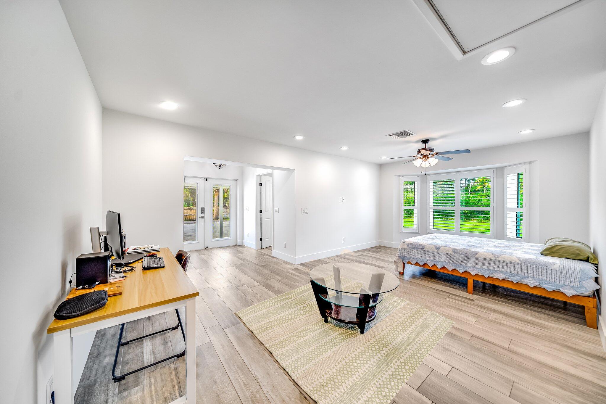 9268 Rodeo Drive Lake Worth, FL 33467 - Photo 31 of 66 a living room with furniture and a table