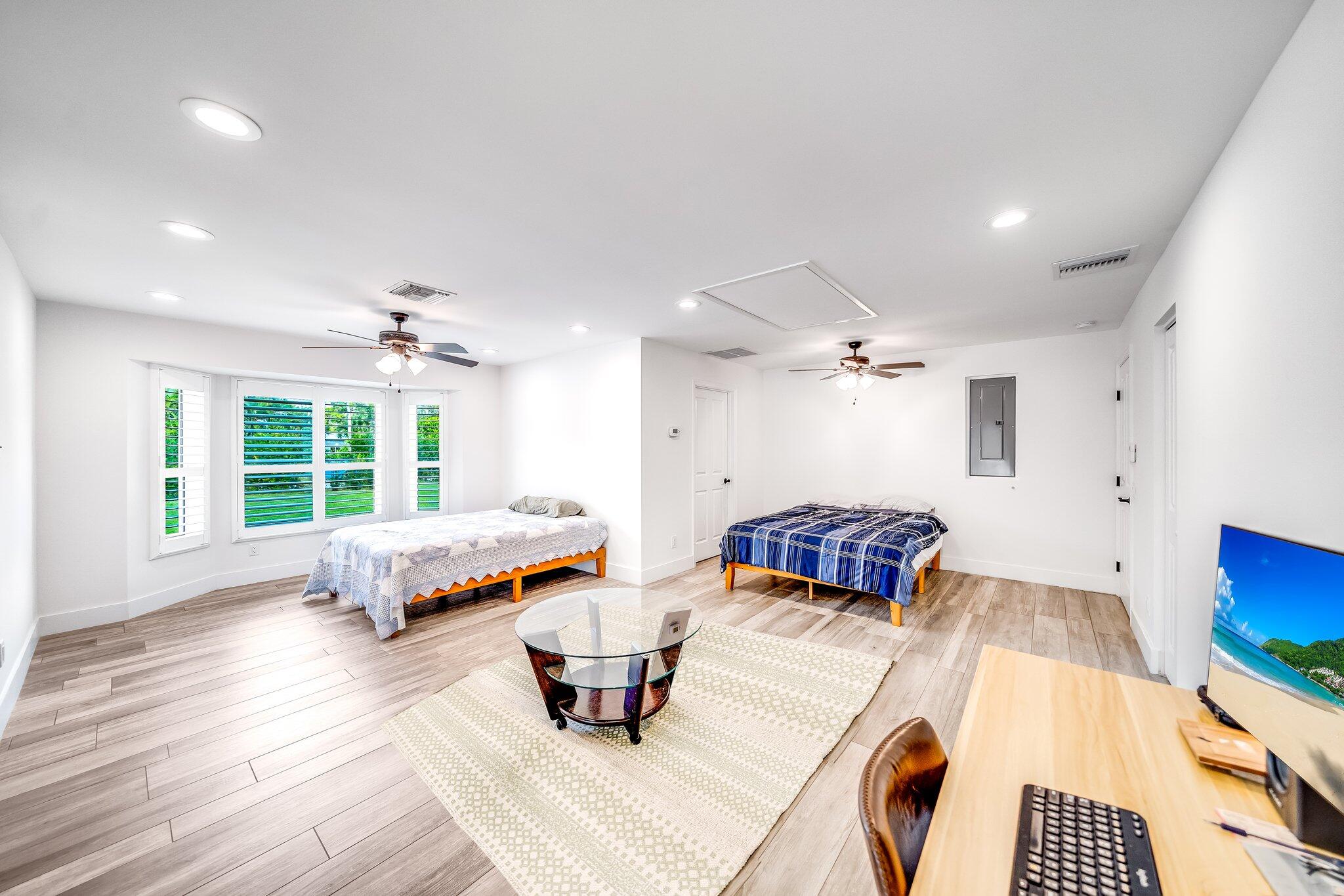9268 Rodeo Drive Lake Worth, FL 33467 - Photo 33 of 66 a living room with furniture and a large window