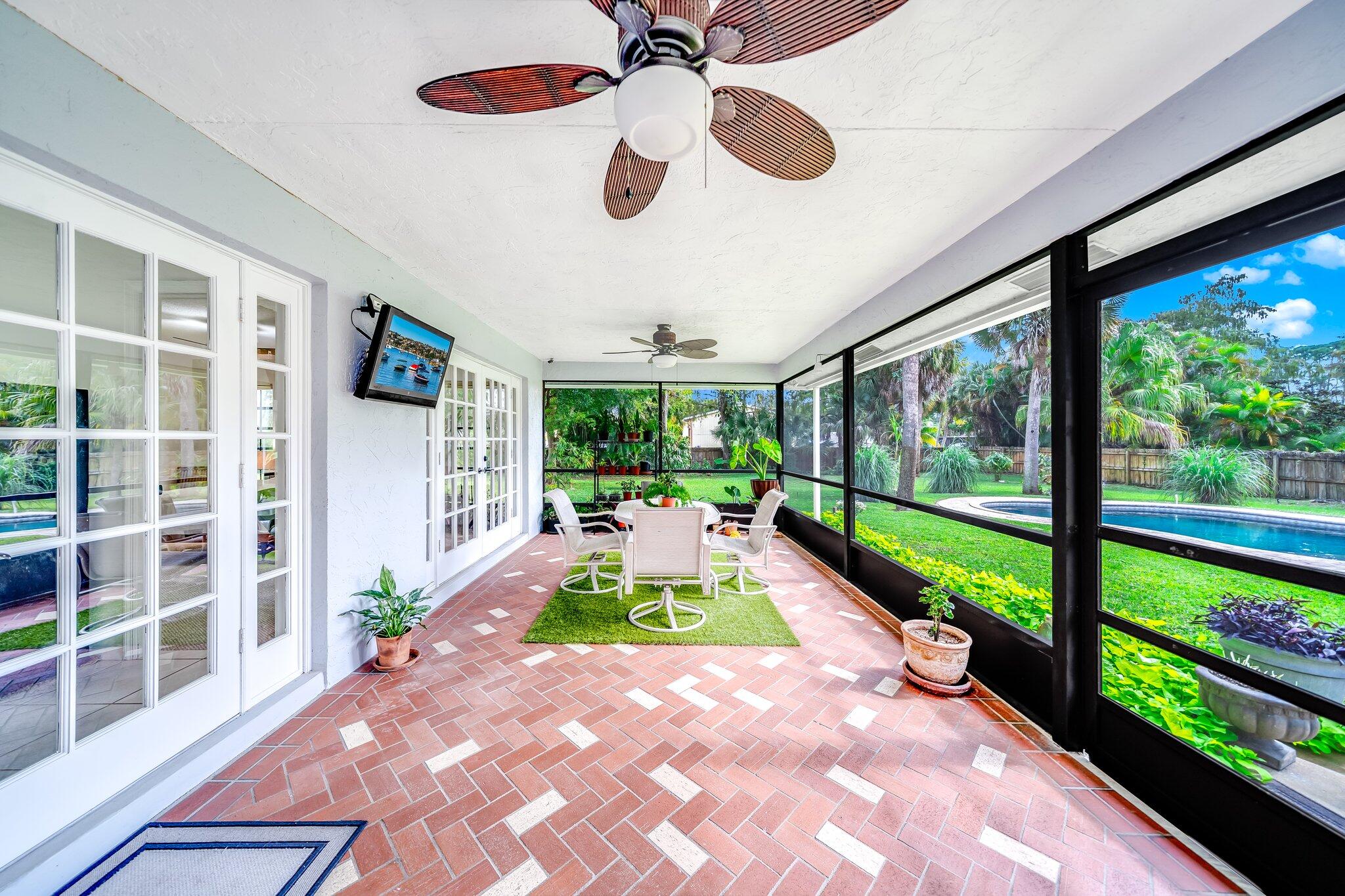 9268 Rodeo Drive Lake Worth, FL 33467 - Photo 35 of 66 a view of swimming pool with a porch