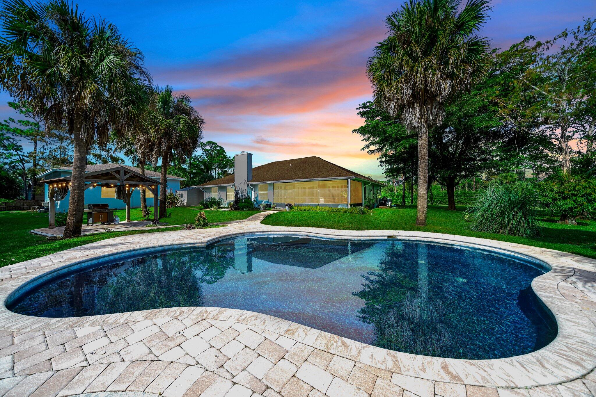 9268 Rodeo Drive Lake Worth, FL 33467 - Photo 42 of 66 a view of swimming pool with a yard