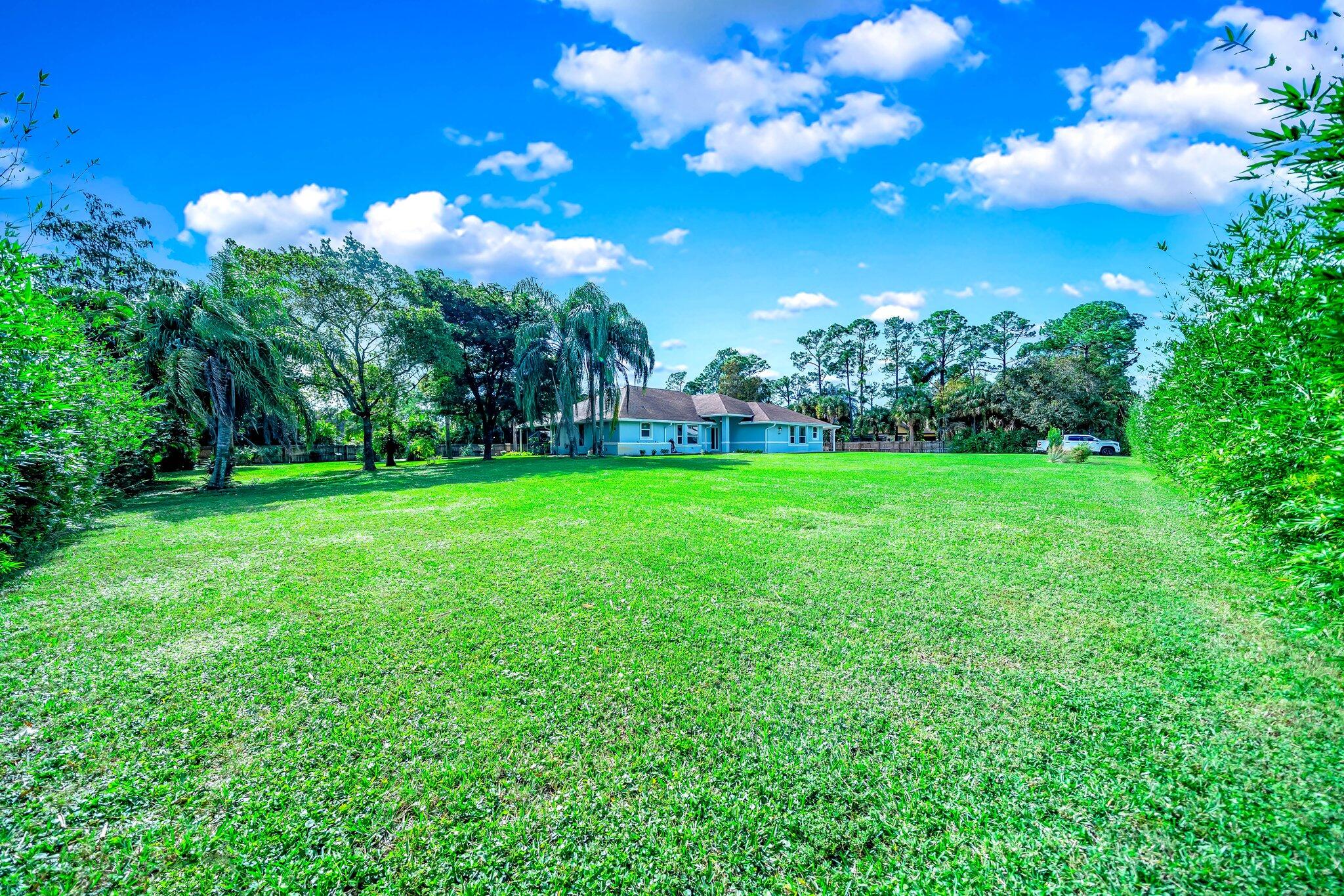 9268 Rodeo Drive Lake Worth, FL 33467 - Photo 51 of 66 a view of a golf course with a tree