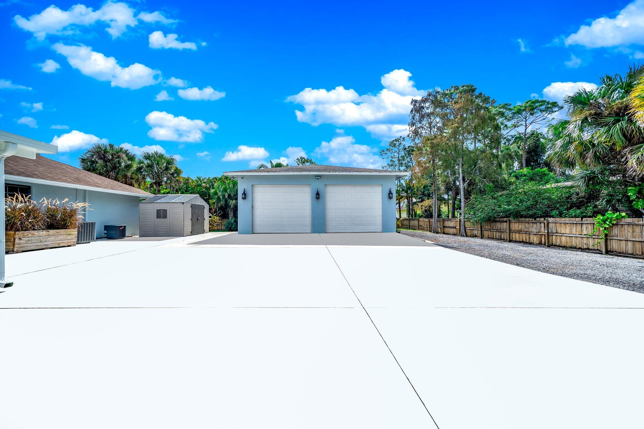 9268 Rodeo Drive Lake Worth, FL 33467 - Photo 53 of 66 a view of a house with a yard and potted plants