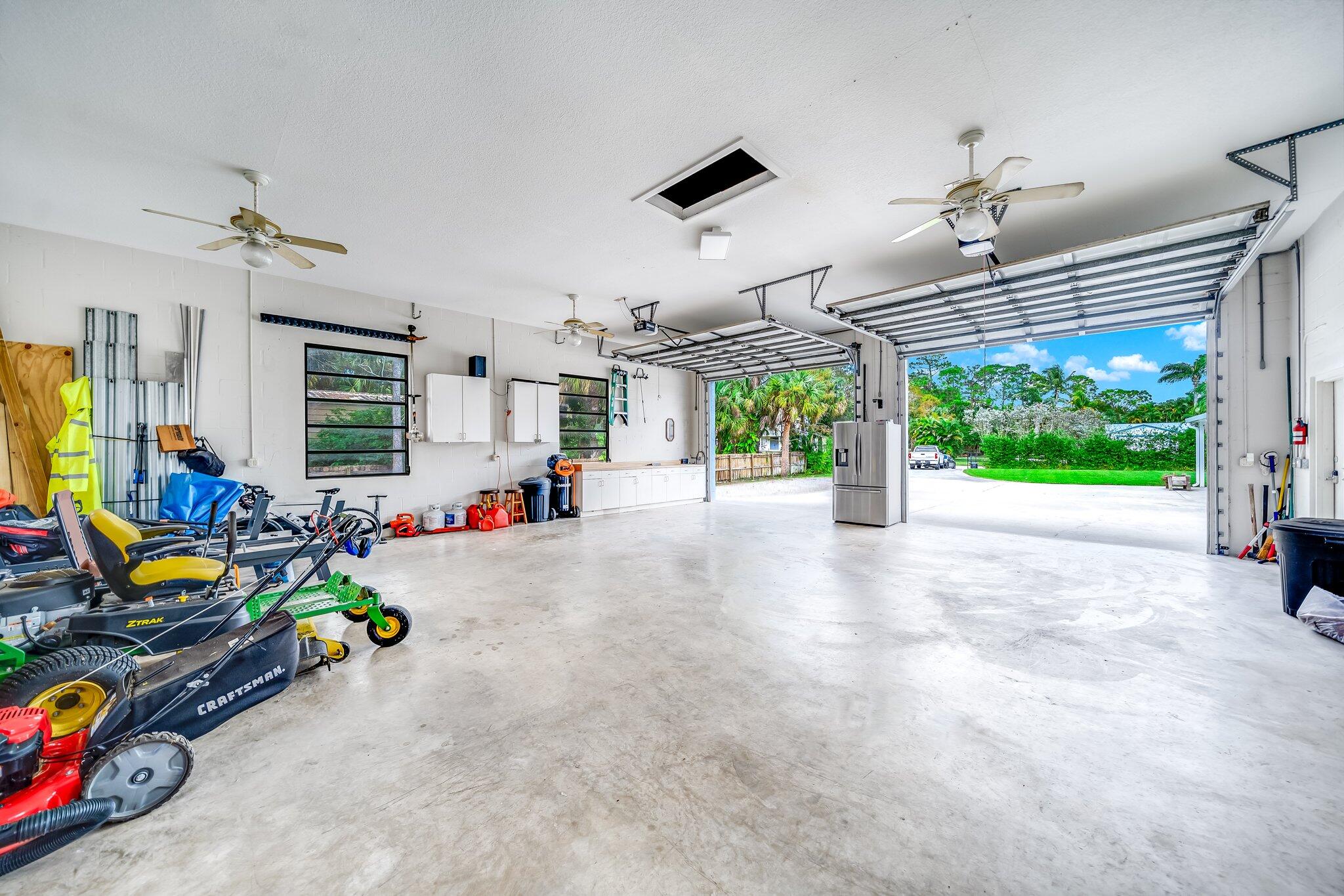 9268 Rodeo Drive Lake Worth, FL 33467 - Photo 55 of 66 a view of a room with gym equipment