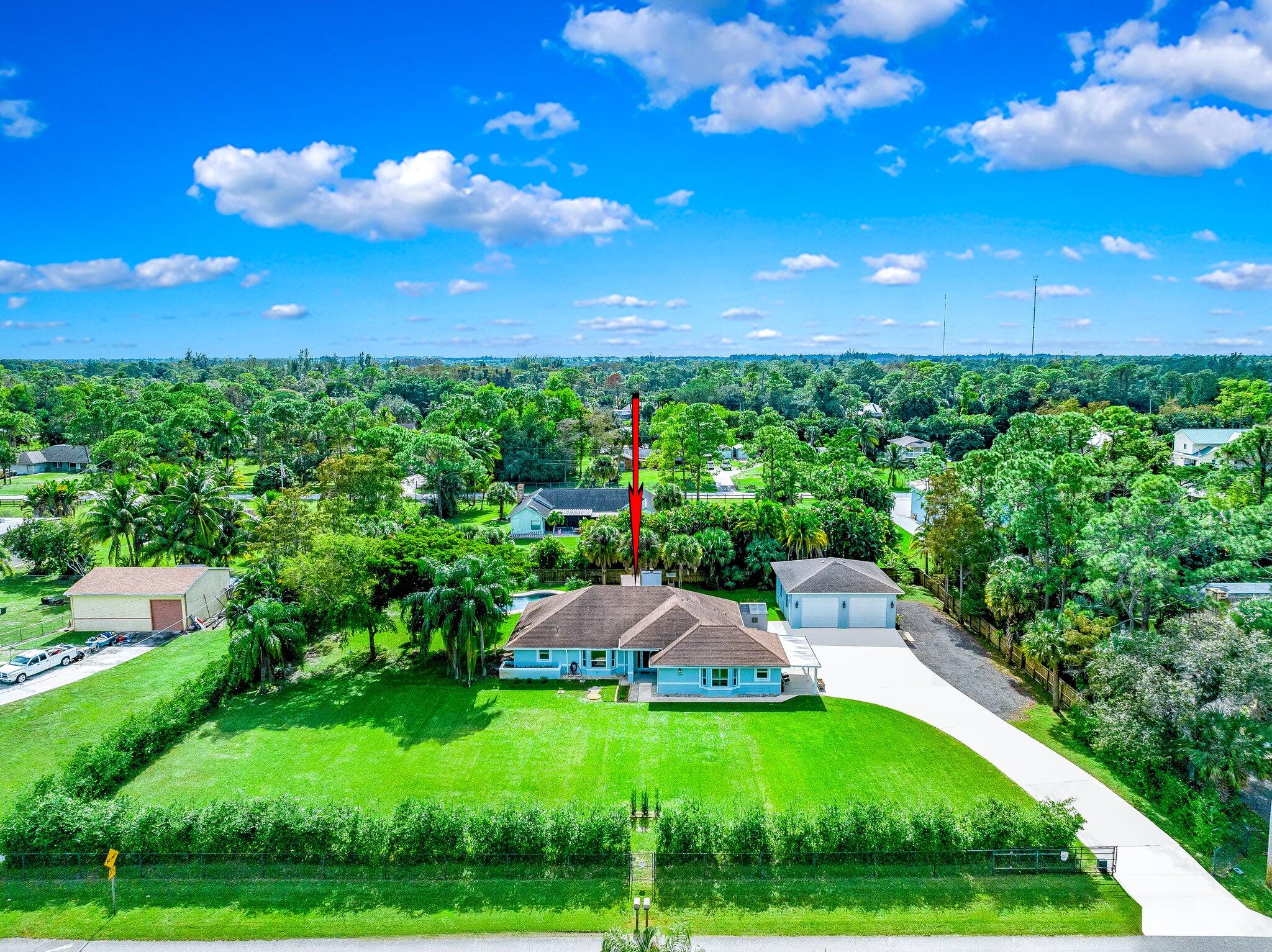 9268 Rodeo Drive Lake Worth, FL 33467 - Photo 66 of 66 a view of yard with swimming pool and green space