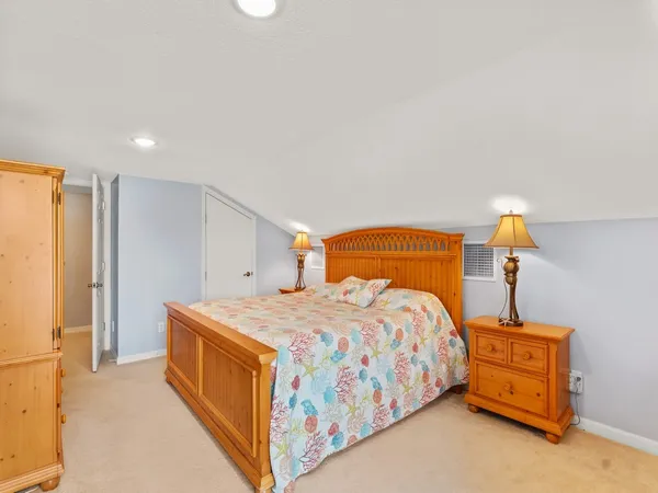 a bedroom with a bed and a cabinets