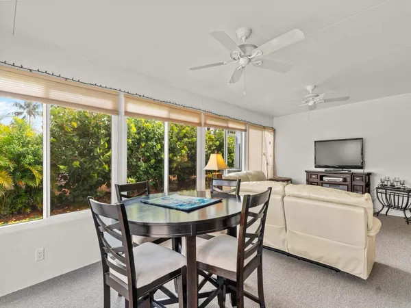 a view of a dining room with furniture window and outside view
