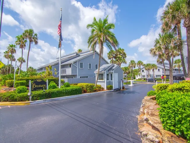 a view of a pathway with a house in the background