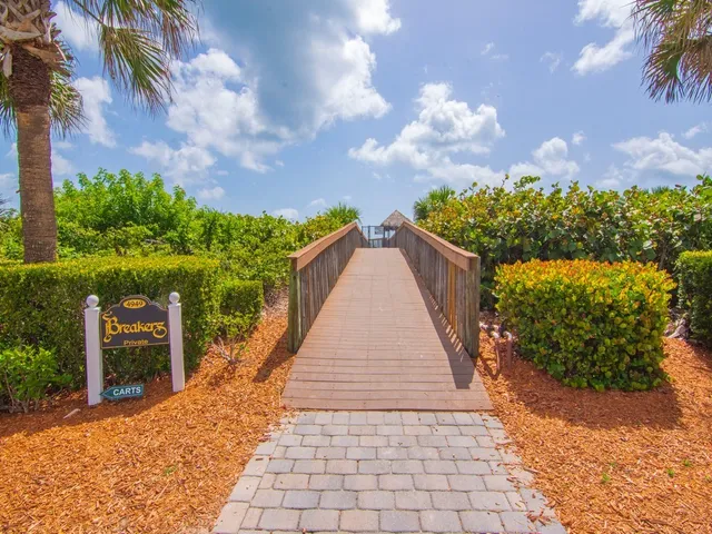 a view of a balcony with wooden fence