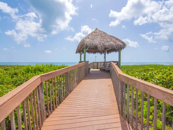 a view of a balcony with two chairs
