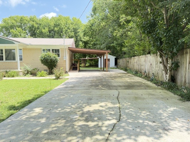 1300 Pleasant Ridge Road Huntland, TN 37345 - Photo 15 of 22 a view of a house with backyard and a garden