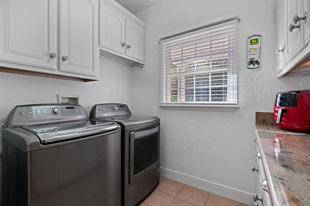 72 Crown Road Willow Park, TX 76087 - Photo 27 of 40 a utility room with sink dryer and washer