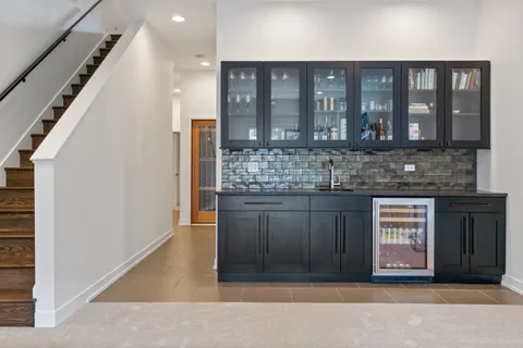 a kitchen with a refrigerator and a sink