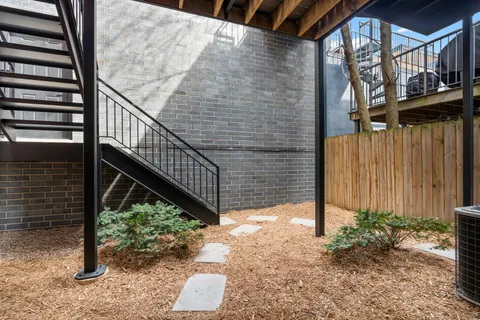 a view of balcony with wooden floor
