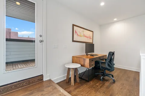 a workspace with furniture and a window