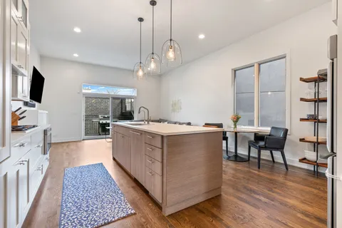 a large white kitchen with lots of counter space