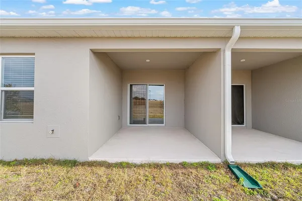 a front view of a house with seating space