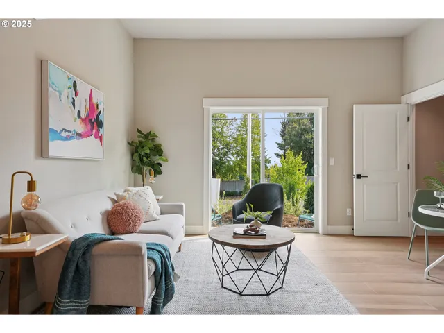 a living room with furniture and a window