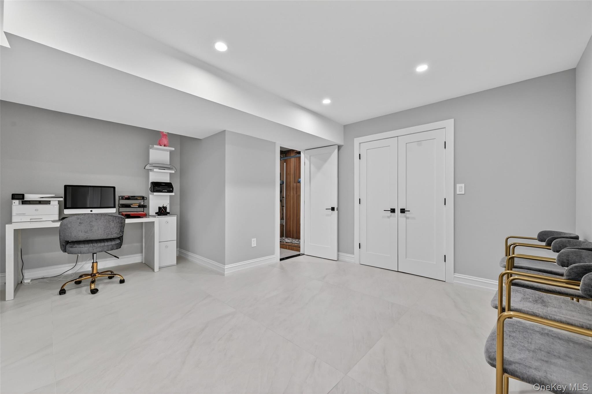 65 Wildway Bronxville, NY 10708 - Photo 23 of 42 Spacious room featuring light gray walls, large format tile flooring, recessed lighting, and white trim
