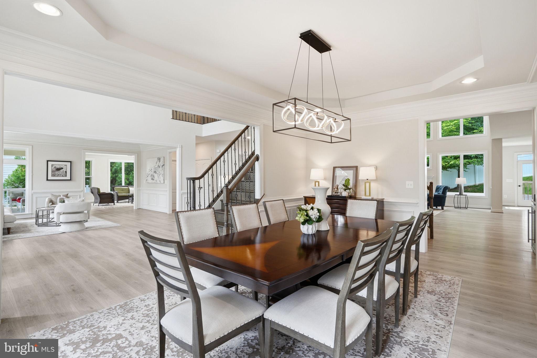 7821 Old Falls Road McLean, VA 22102 - Photo 11 of 62 a view of a dining room with furniture wooden floor and chandelier