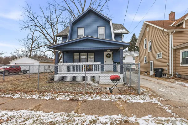 a front view of a house with garage