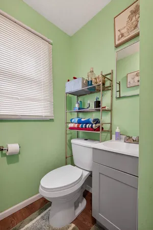 a room with a sink cabinets and a window