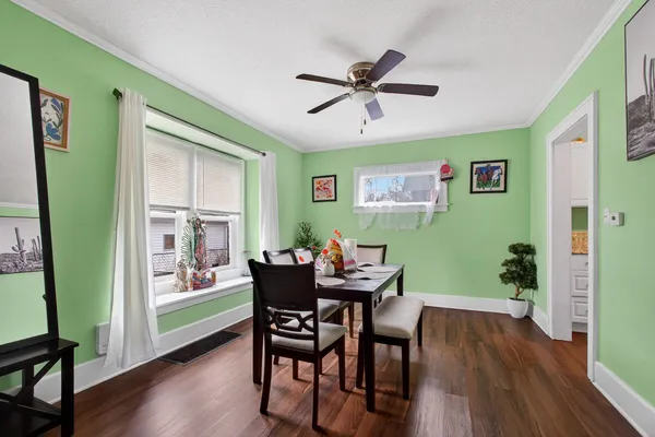 a view of a dining room with furniture window and wooden floor