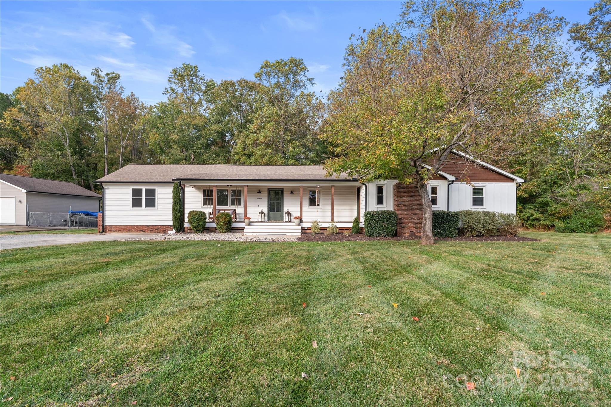 a front of a house with a garden