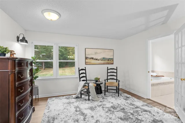 a view of a livingroom with furniture and windows