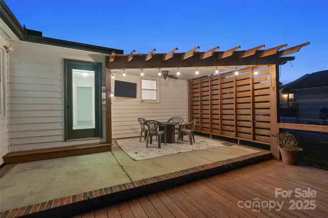 a view of a patio with a table and chairs