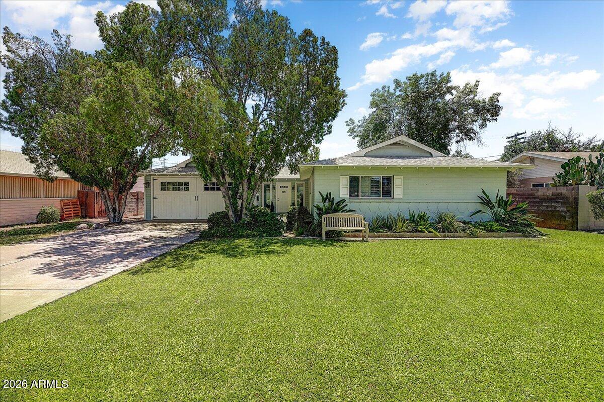 607 West 15th Street Tempe, AZ 85281 - Photo 1 of 29 a front view of a house with a garden