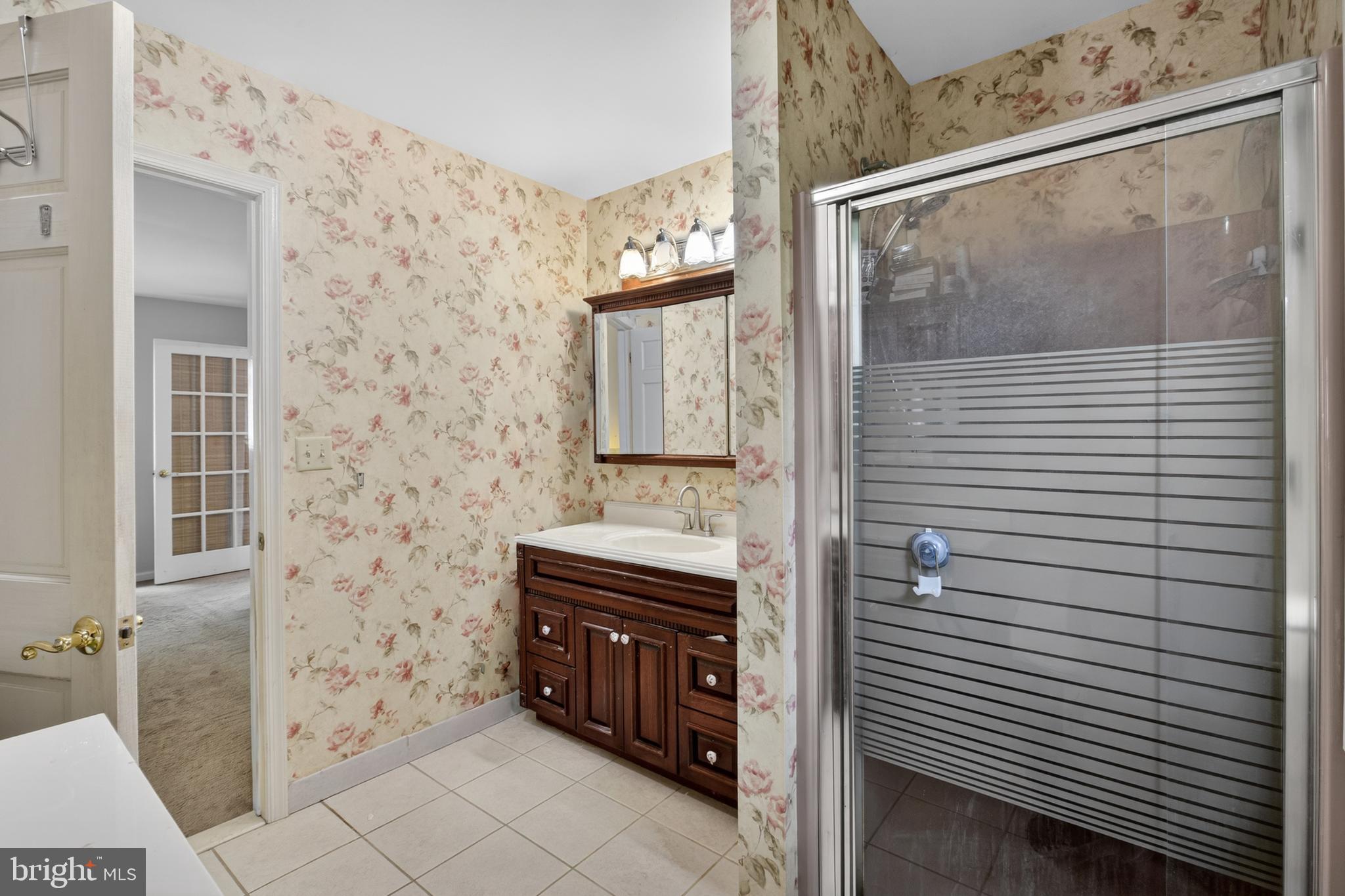 216 Revere Road Marlton, NJ 08053 - Photo 28 of 47 a bathroom with a double vanity sink and mirror