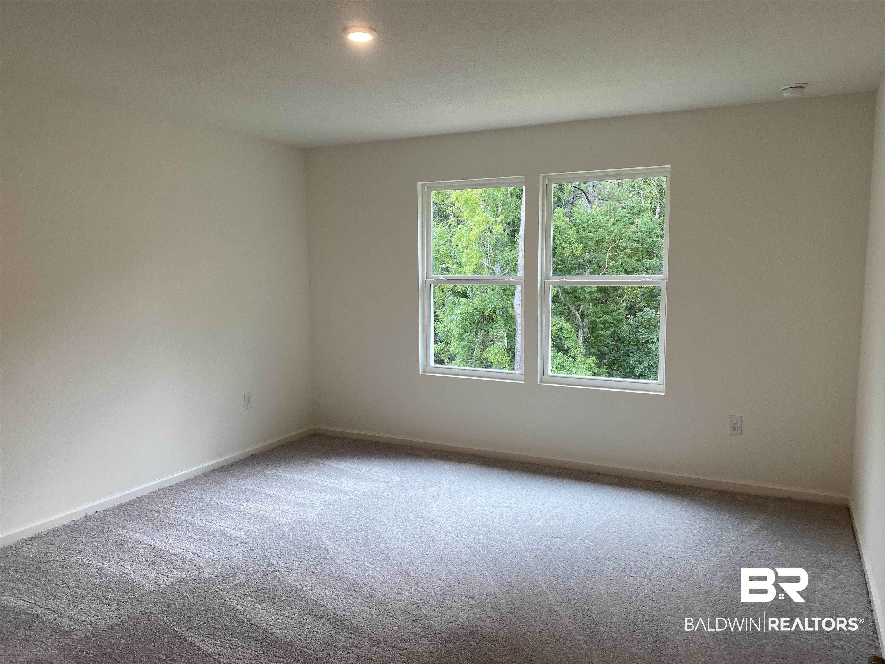 21676 Yosemite Boulevard Fairhope, AL 36532 - Photo 8 of 19 Empty room with carpet