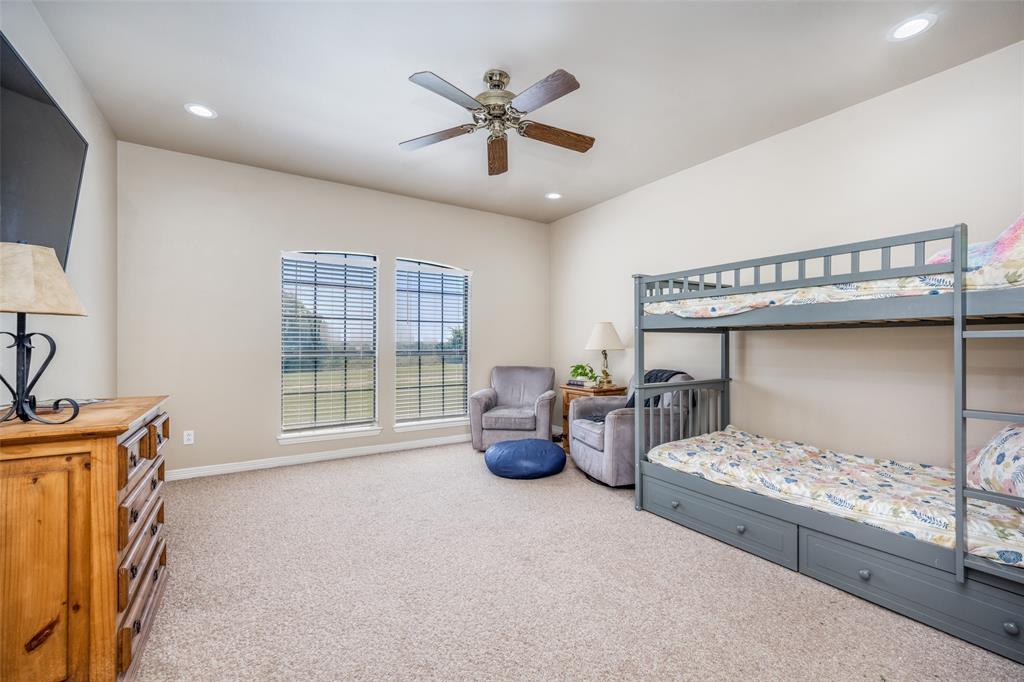 778 County Road 3141 Decatur, TX 76234 - Photo 21 of 25 a bedroom with furniture and windows