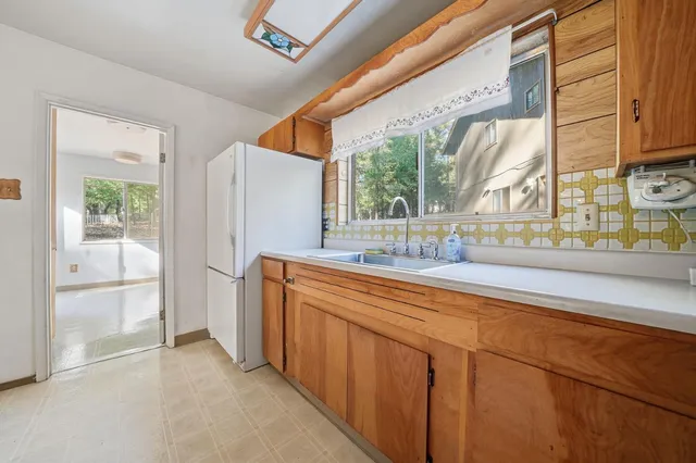 a bathroom with a sink and a large mirror