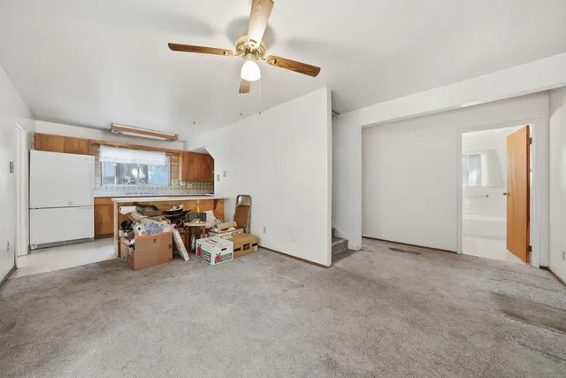 an empty room with furniture and windows