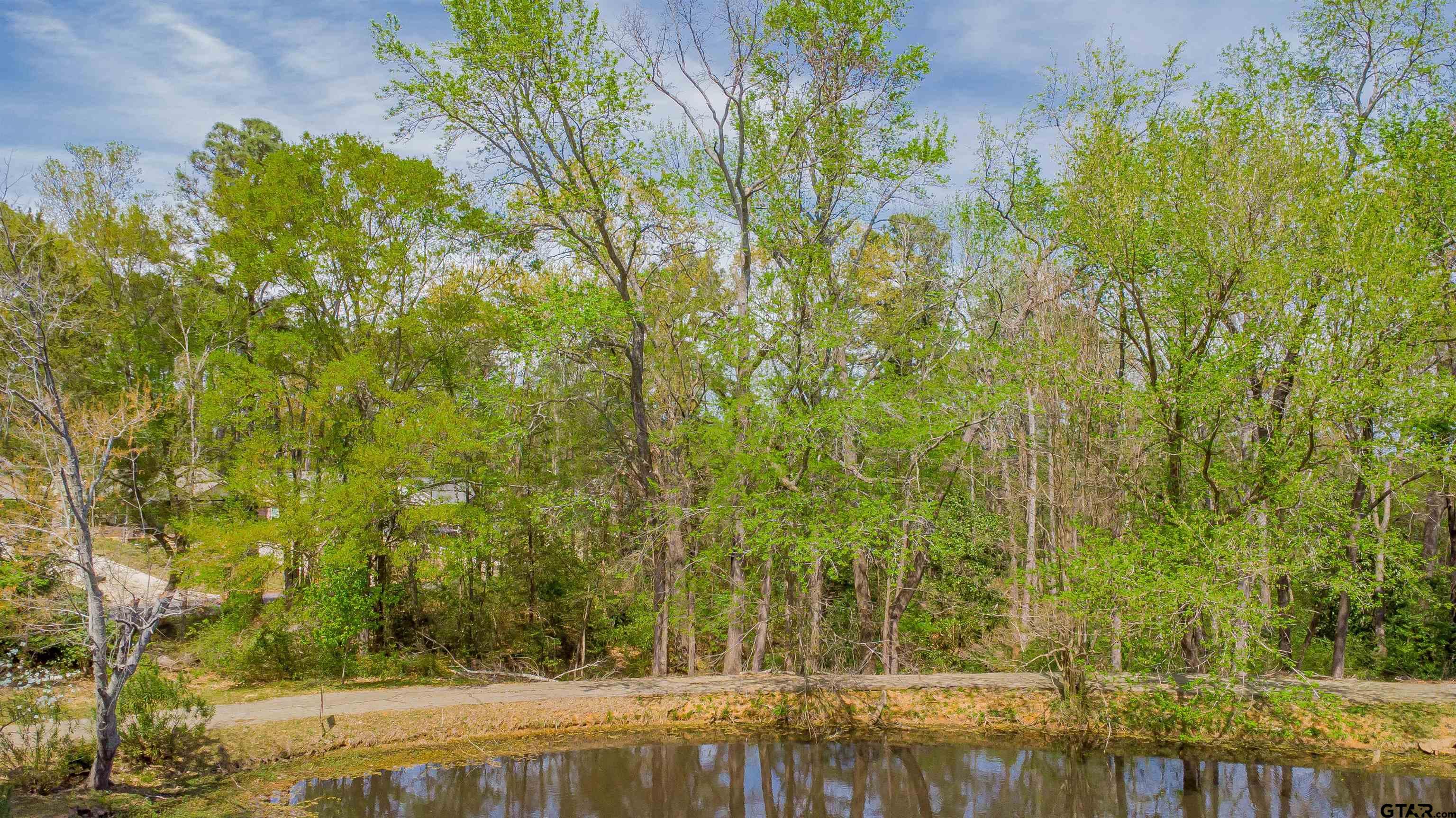 2864 South Robertson Avenue Tyler, TX 75701 - Photo 3 of 39 a view of swimming pool from a yard