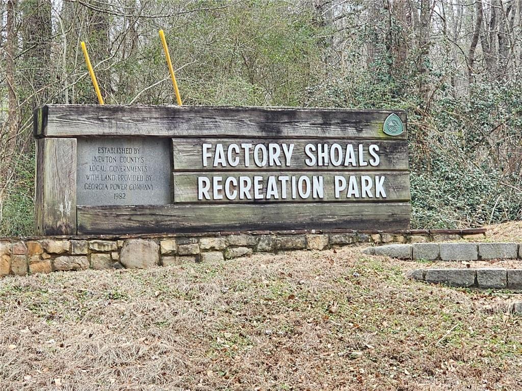 a view of a sign under a bridge
