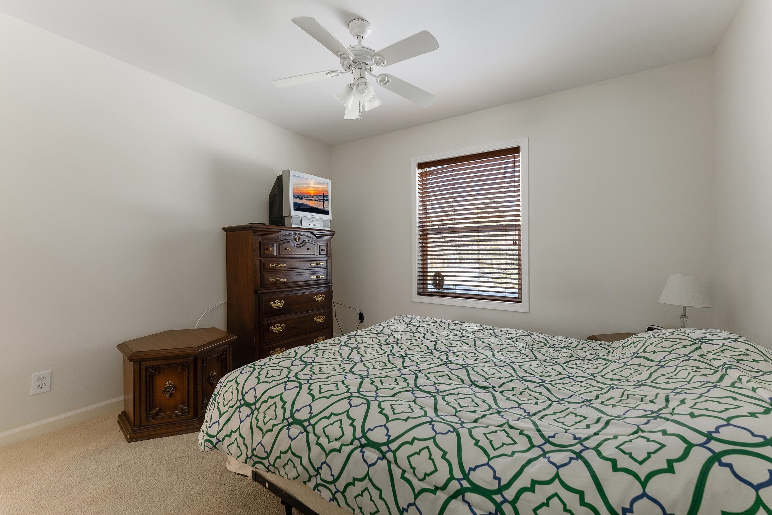 204 Tuckahoe Road Marmora, NJ 08223 - Photo 12 of 19 a bedroom with a bed and a television