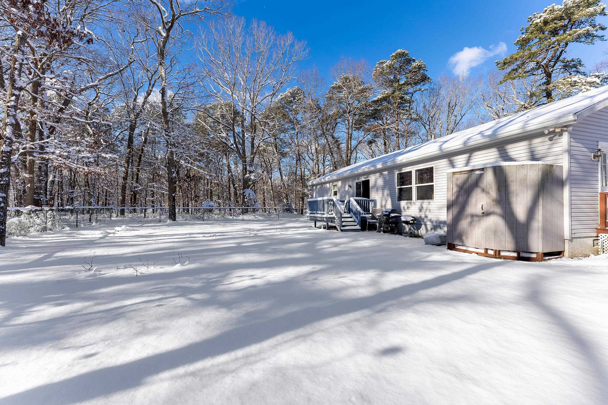 204 Tuckahoe Road Marmora, NJ 08223 - Photo 17 of 19 a house with trees in front of it