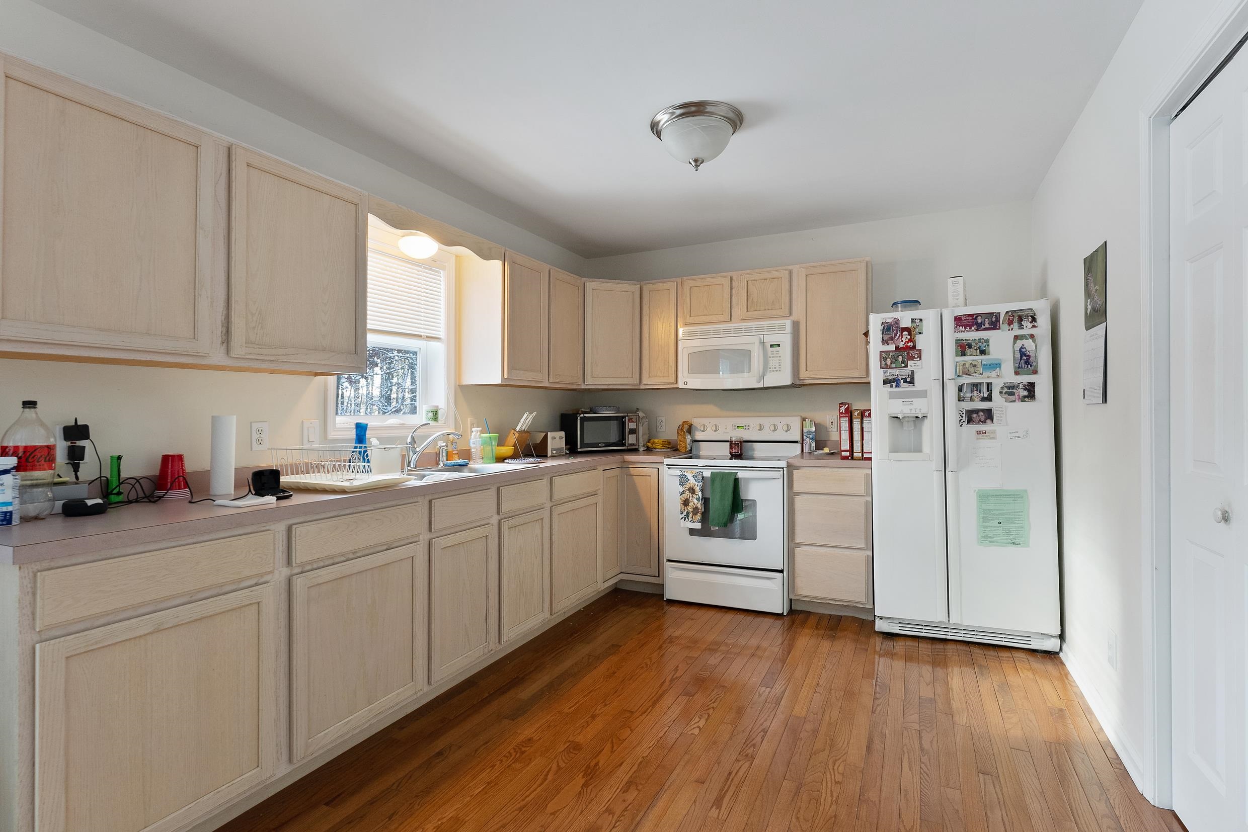 204 Tuckahoe Road Marmora, NJ 08223 - Photo 5 of 19 a kitchen with white cabinets and white appliances