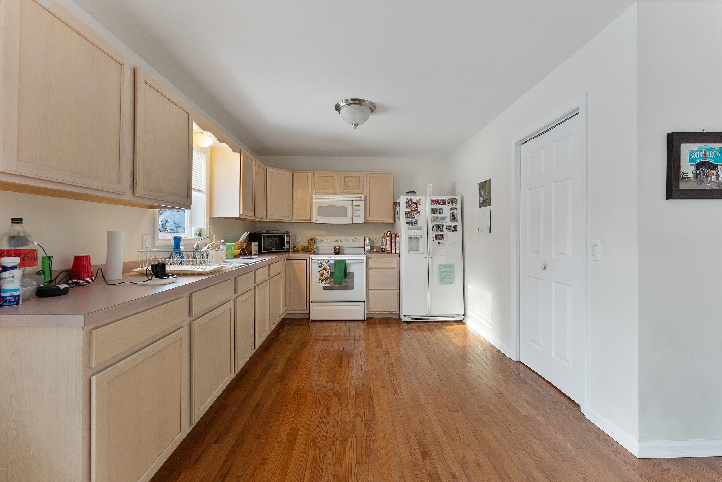 204 Tuckahoe Road Marmora, NJ 08223 - Photo 6 of 19 a kitchen with cabinets a sink and wooden floor