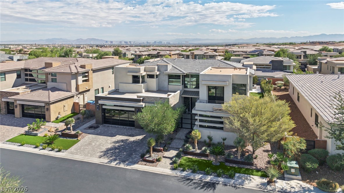 4208 Lapis Ridge Court Las Vegas, NV 89135 - Photo 52 of 61 Striking contemporary architecture showcases clean geometric lines against a backdrop of distant city views.
