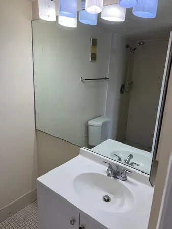 a bathroom with a sink and mirror