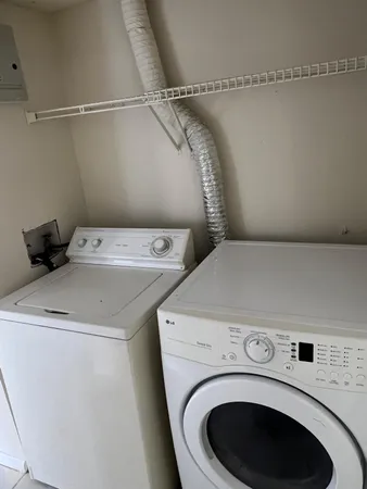 a utility room with dryer and washer