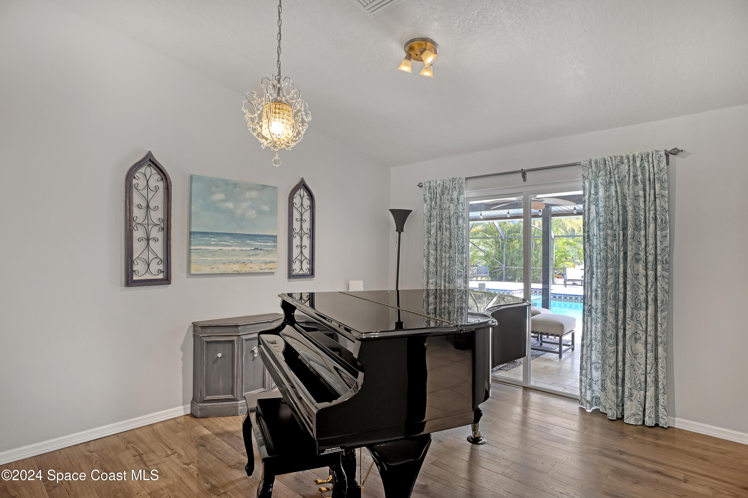 3865 Corey Road Malabar, FL 32950 - Photo 15 of 72 a view of a dining room with furniture window and wooden floor