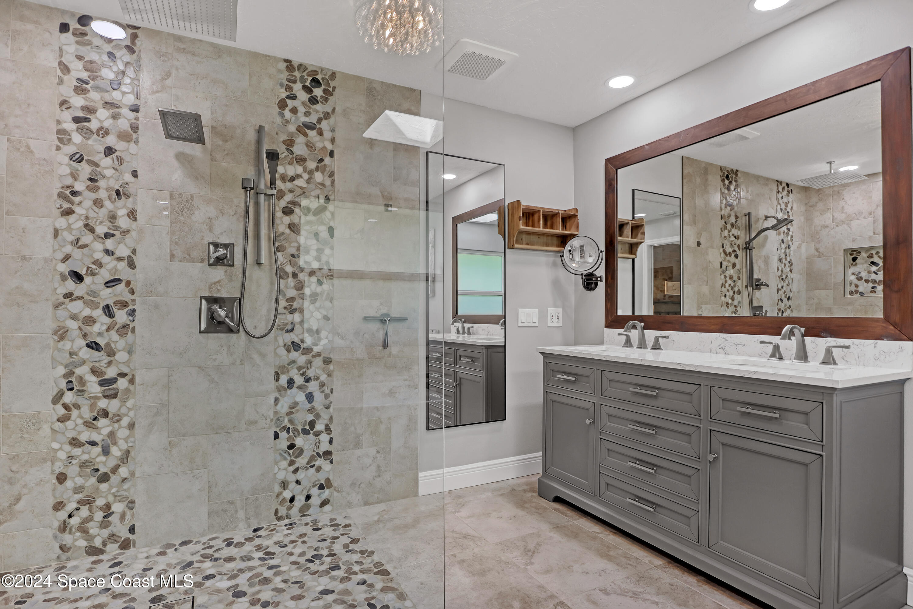 3865 Corey Road Malabar, FL 32950 - Photo 19 of 72 a bathroom with a bathtub sink and mirror