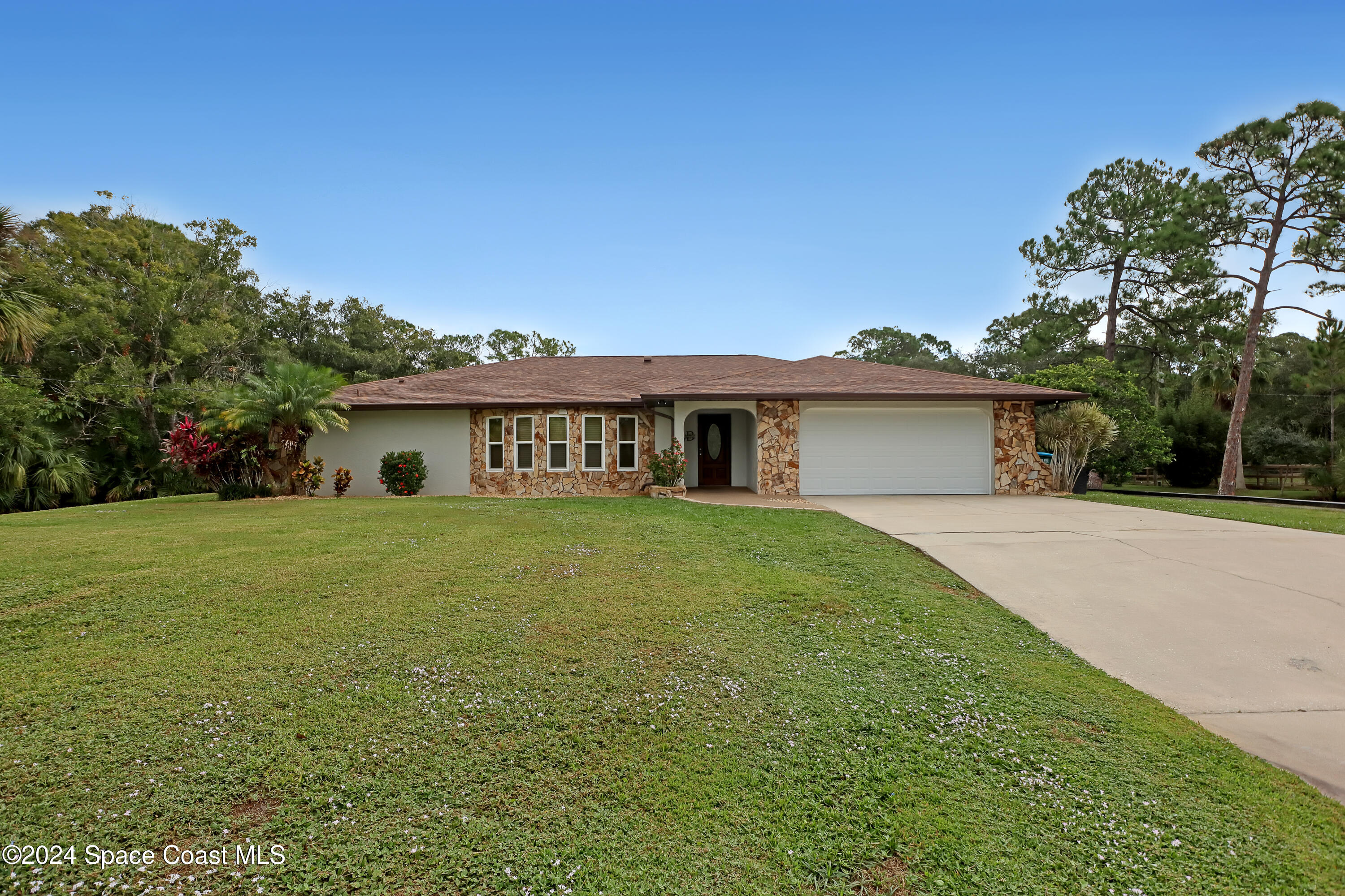 3865 Corey Road Malabar, FL 32950 - Photo 2 of 72 a front view of house with yard and green space